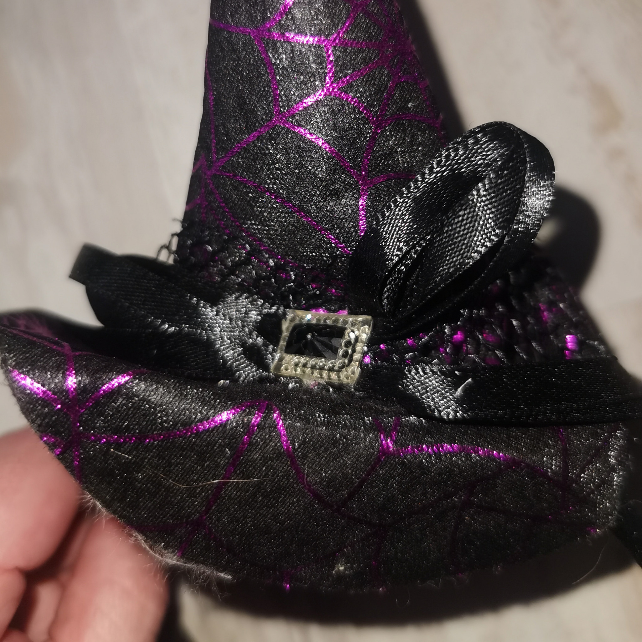 Tiny purple and black witch hat on alice band